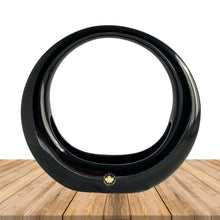 Load image into Gallery viewer, Vintage retro art deco style circular ceramic planter finished in glossy black or white glaze and felted bottom. Crafted by Sedan Manufacturing, Canada, circa 1980s. Nestle in a few of your favourite plants or succulents to create a lovely little container garden or put together a sweet holiday display with bottle brush Christmas trees and ornaments.