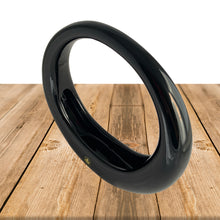 Load image into Gallery viewer, Vintage retro art deco style circular ceramic planter finished in glossy black or white glaze and felted bottom. Crafted by Sedan Manufacturing, Canada, circa 1980s. Nestle in a few of your favourite plants or succulents to create a lovely little container garden or put together a sweet holiday display with bottle brush Christmas trees and ornaments.