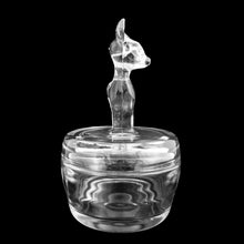 Load image into Gallery viewer, Side profile of vintage clear glass Jeannette Glass powder jar with raised deer fawn design