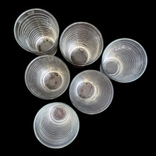 Load image into Gallery viewer, Overhead view of six vintage Libbey clear glass hoop tumblers showing the concentric ribbed interior and rims