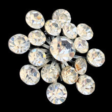 Load image into Gallery viewer, Close-up angled view of vintage clear rhinestone cluster brooch showing faceted stone brilliance and silver-tone prong settings