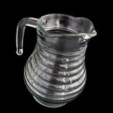 Load image into Gallery viewer, Angled view of vintage clear glass beehive pitcher highlighting ribbed texture and open pour spout