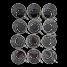 Load image into Gallery viewer, Vintage clear Soreno pressed glass punch bowl and 12 matching cups featuring a textured bark surface. Crafted by Anchor Hocking, USA, 1966 - 1970. Perfect for serving your favourite concocted beverages.
All in excellent condition, no chips.
Bowl measures 12 3/4 x 6 inches
Cups measure 3 x 2 5/8 inches
