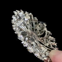 Load image into Gallery viewer, Close up of reverse of vintage clear rhinestone starburst brooch showing silver-tone pin clasp closure