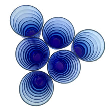 Load image into Gallery viewer, Overhead view of six cobalt blue Cameron tumblers, concentric beehive rings visible inside each open rim