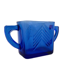 Load image into Gallery viewer, Classic vintage cobalt blue "Chevron" pressed glass sugar. Produced by Hazel-Atlas Glass, USA, circa 1930s. Made in two sizes, this is the smaller version. A stunning example of art deco design for your kitchen and table! In excellent condition, free from chips or cracks. Measures 5 1/2 x 2 x 3 inches (incl. handle) 
