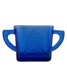 Load image into Gallery viewer, Classic vintage cobalt blue "Chevron" pressed glass sugar. Produced by Hazel-Atlas Glass, USA, circa 1930s. Made in two sizes, this is the smaller version. A stunning example of art deco design for your kitchen and table! In excellent condition, free from chips or cracks. Measures 5 1/2 x 2 x 3 inches (incl. handle) 