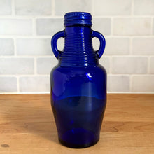 Load image into Gallery viewer, Back view of vintage cobalt blue Luna Café bottle by Madera Glass Co., perfect for mid-century shelf décor