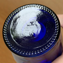 Load image into Gallery viewer, Bottom of vintage cobalt blue Luna Café bottle showing maker's mark, Madera Glass Co. California 1998