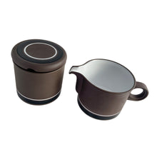 Load image into Gallery viewer, These morning cuppa helpers are gorgeous! A fabulous vintage graphic "Contrast" creamer and covered sugar feature brown on deep brown with contrasting white stripe. Crafted by Hornsea, England, between 1978 - 1987. Their retro styling has stood the test of time and trends!  In excellent condition free from chips/cracks.  Creamer measures 3 5/8 x 3 inches  Covered sugar measures 3 1/4 x 3 5/8 inches
