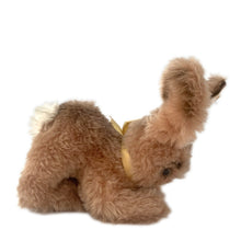 Load image into Gallery viewer, Vintage stuffed animal tan light brown bunny rabbit. Washable Dralon plush material. Hand embroidered pink nose and brown mouth, brown glass eyes with black pupils, and light beige felt rear foot pads. Gold satin ribbon and round red, blue and yellow tag bearing the name Cosy Mummy. Brass button-in-ear yellow and black tag 494020 and paper tag. Steiff, Germany 1970s. This bunny rabbit sits in a seated or reclining position. In excellent condition. Measures 8 1/2 inches or 22cm