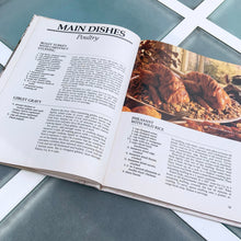 Load image into Gallery viewer, Better Homes and Gardens is known for its fabulous cookbooks. This hardcover cookbook focuses on country cooking recipes and designs. Its 96 pages are filled with amazing recipes along with many colour photographs. Originally published by Meredith Corporation, USA, 1983. This is the third printing 1984. In great vintage condition with normal age-related yellowing.