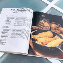 Load image into Gallery viewer, Better Homes and Gardens is known for its fabulous cookbooks. This hardcover cookbook focuses on country cooking recipes and designs. Its 96 pages are filled with amazing recipes along with many colour photographs. Originally published by Meredith Corporation, USA, 1983. This is the third printing 1984. In great vintage condition with normal age-related yellowing.