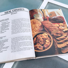 Load image into Gallery viewer, Better Homes and Gardens is known for its fabulous cookbooks. This hardcover cookbook focuses on country cooking recipes and designs. Its 96 pages are filled with amazing recipes along with many colour photographs. Originally published by Meredith Corporation, USA, 1983. This is the third printing 1984. In great vintage condition with normal age-related yellowing.