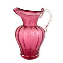 Load image into Gallery viewer, Beautiful vintage hand blown optic cranberry glass pitcher with wide wavy rim and applied glass handle. Crafted by Pilgrim Glass, USA. A stunning piece of handcrafted art glass, practical and beautiful! In excellent condition, no chips. Measures 6 x 9 1/2 inches. Capacity 64 ounces