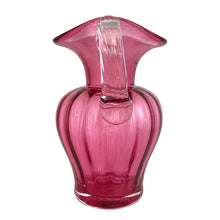 Load image into Gallery viewer, Beautiful vintage hand blown optic cranberry glass pitcher with wide wavy rim and applied glass handle. Crafted by Pilgrim Glass, USA. A stunning piece of handcrafted art glass, practical and beautiful! In excellent condition, no chips. Measures 6 x 9 1/2 inches. Capacity 64 ounces