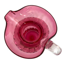 Load image into Gallery viewer, Beautiful vintage hand blown optic cranberry glass pitcher with wide wavy rim and applied glass handle. Crafted by Pilgrim Glass, USA. A stunning piece of handcrafted art glass, practical and beautiful! In excellent condition, no chips. Measures 6 x 9 1/2 inches. Capacity 64 ounces