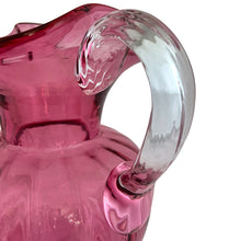 Load image into Gallery viewer, Beautiful vintage hand blown optic cranberry glass pitcher with wide wavy rim and applied glass handle. Crafted by Pilgrim Glass, USA. A stunning piece of handcrafted art glass, practical and beautiful! In excellent condition, no chips. Measures 6 x 9 1/2 inches. Capacity 64 ounces