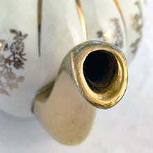 Load image into Gallery viewer, Vintage W777 teapot, creamer and sugar set features vertically ribbed cream body, with cream ground and gold gilt flowers and details. Crafted by Gibsons, England, circa 1950s. Whether the star of your high tea service or for everyday use, you'll appreciate this beautifully decorated quality earthenware.
In excellent condition, no chips/cracks/repairs.
