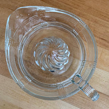 Load image into Gallery viewer, We are loving this vintage clear depression glass "Criss Cross" citrus juice reamer. Every home should have one of these practical kitchen helpers that makes squeezing oranges, lemons and limes a breeze! This one has a convenient spout and smooth finger handle design. Produced by Hazel-Atlas Glass, USA, circa 1930s. Perfect for the fresh squeezed juice enthusiast...no sugar added! In excellent condition, free from chips/wear. Measures 5 3/4 x 3 1/2 inches