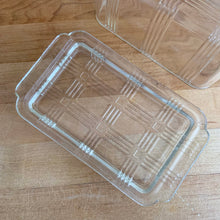 Load image into Gallery viewer, We are loving this vintage clear depression glass "Criss Cross" covered butter dish. Produced by Hazel-Atlas Glass, USA, circa 1930s. Perfect for the vintage kitchen enthusiast! In good vintage condition, lid is free from chips, interior rim of the dish flea bites. Measures 7 x 4 x 3 1/4 inches