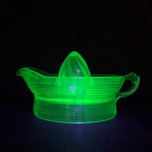 Load image into Gallery viewer, Hard to find vintage green uranium depression glass Criss Cross citrus reamer. Glows brilliantly under black light! Every home should have one of these practical kitchen helpers that makes squeezing citrus fruits a breeze! Crafted by Hazel-Atlas Glass, USA, 1930s. Perfect for the fresh squeezed juice enthusiast...no sugar added!
In excellent condition, no chips/wear.
Measures 5 3/4 x 3 1/2 inches