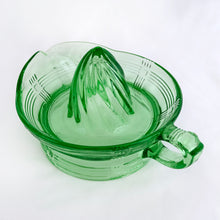 Load image into Gallery viewer, Hard to find vintage green uranium depression glass Criss Cross citrus reamer. Glows brilliantly under black light! Every home should have one of these practical kitchen helpers that makes squeezing citrus fruits a breeze! Crafted by Hazel-Atlas Glass, USA, 1930s. Perfect for the fresh squeezed juice enthusiast...no sugar added!
In excellent condition, no chips/wear.
Measures 5 3/4 x 3 1/2 inches