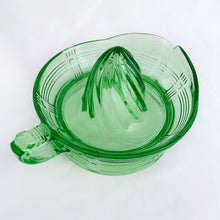 Load image into Gallery viewer, Hard to find vintage green uranium depression glass Criss Cross citrus reamer. Glows brilliantly under black light! Every home should have one of these practical kitchen helpers that makes squeezing citrus fruits a breeze! Crafted by Hazel-Atlas Glass, USA, 1930s. Perfect for the fresh squeezed juice enthusiast...no sugar added!
In excellent condition, no chips/wear.
Measures 5 3/4 x 3 1/2 inches