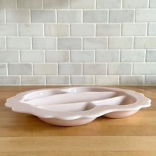 Load image into Gallery viewer, Rare vintage "Crown Tuscan" pink milk glass relish or vanity tray features five sections finished with a wide scalloped edge. Crafted by Cambridge Glass, USA, 1940s. This stunning pale pink milk glass tray is sure to add an elegant touch to your tablescape or dresser. In good vintage condition, with a flea bite to the inner rim which does not detract from the beauty of this piece. Measures 12 1/4 x 10 1/2 inches