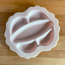 Load image into Gallery viewer, Rare vintage "Crown Tuscan" pink milk glass relish or vanity tray features five sections finished with a wide scalloped edge. Crafted by Cambridge Glass, USA, 1940s. This stunning pale pink milk glass tray is sure to add an elegant touch to your tablescape or dresser. In good vintage condition, with a flea bite to the inner rim which does not detract from the beauty of this piece. Measures 12 1/4 x 10 1/2 inches