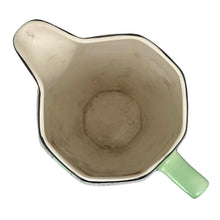 Load image into Gallery viewer, Overhead view of Vintage Crownford Art Nouveau Art Deco Ford & Sons ceramic green pitcher with elongated pink floral motif with black and white geometric scale motif at the rim, England 1930s 1940s