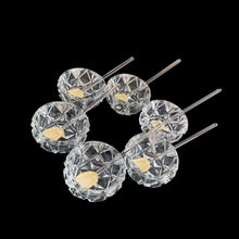 Load image into Gallery viewer, Vintage set of six crystal salt cellars and spoons. Crafted by Bohemia Crystal, circa 1950s. A lovely addition to your tablescape. New in box in excellent vintage condition. Each spoon is wrapped and has the original yellow sticker which reads Bohemia Crystal, Made in Czechoslovakia. Salt cellars measure 1 5/8 x 7/8 inches. Spoons measure 2 3/4 inches