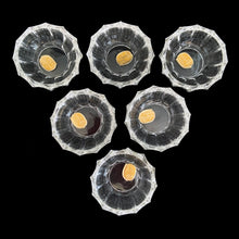 Load image into Gallery viewer, Vintage set of six crystal salt cellars and spoons. Crafted by Bohemia Crystal, circa 1950s. A lovely addition to your tablescape. While the cellars and spoons are new in box, some have rough edges from mold release. Each piece has the original yellow sticker which read Bohemia Crystal, Made in Czechoslovakia. Salt cellars measure 2 3/8 x 7/8 inches. Spoons measure 2 3/4 inches
