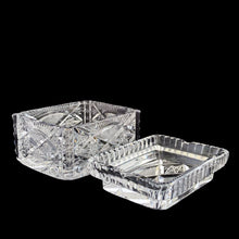 Load image into Gallery viewer, Elegant vintage cut crystal lidded cigarette box. Crafted by Bohemia Crystal, Czechoslovakia, 1970s. This box provides a decorative way to store cigarettes with the lid functioning as an ashtray. Not a smoker? Use this versatile elegant box to store playing cards, candies or trinkets. Add this statement piece to your home decor or give as a gift.
In excellent condition, no chips.
Measures 4 1/2 x 3 3/8 x 3 1/2 inches