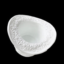 Load image into Gallery viewer, This vintage milk glass top hat captures mid-century charm with its signature Daisy and Button embossed design. Crafted by Indiana Glass, USA, 1960s. Serve candies and nuts in style, or reimagine it as a holder for brushes, a bud vase, or desktop organizer—its versatility makes it an indispensable addition to any curated space. A timeless piece that proves vintage treasures deserve a place in today's home.
In excellent condition, no chips.
Measures 4 1/2 x 3 1/4 inches