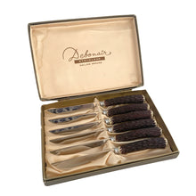 Load image into Gallery viewer, Vintage Debonair faux antler handled stainless steel steak knives in original silk lined box. Crafted by MB Hollow Ground, Japan, 1950s. Add the lodge look to your table settings with these unique knives.
In excellent condition, new in box.
Knife measures 8 3/8 inches