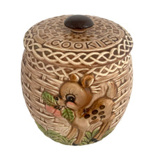 Load image into Gallery viewer, ESD Lefton ceramic cookie jar, three-quarter view — basketweave body with relief deer and apple sprig appliqué visible on lower right, braided lid, dark knob