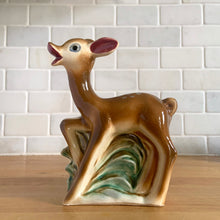 Load image into Gallery viewer, Vintage mid-century hand painted figural deer fawn ceramic planter. Crafted by Shafford, Japan, circa 1950s. This sweet piece will look great as part of your home's decor. Fill with your favourite houseplant and enjoy!  In excellent condition, chip to the interior rim (see photos), no cracks/repairs.  Measures 3 1/2 x 2 3/4 x 6 1/4 inches