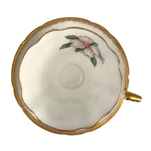 Load image into Gallery viewer, Vintage Dogwood fine bone china teacup and saucer featuring hand painted flowers in shades of pink, gray and green with brush gold gilt trim. Crafted by Paragon, England, 1960s. A lovely way to enjoy a cuppa tea!
In excellent condition, no chips, cracks or repairs. Maker's mark on the bottom.
Measures 3 3/4 x 2 3/4 inches | Saucer measures 5 inches