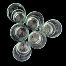 Load image into Gallery viewer, Overhed top view of 1970s Canadian Dominion Glass wavy juice glasses, 6 ounce capacity