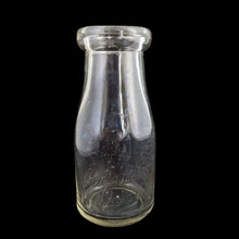 Load image into Gallery viewer, Front view of Donlands Dairy 8 oz Clear Glass Cream Bottle show Donlands embossed logo. Bottle made by Dominion Glass Canada circa 1950s
