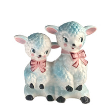 Load image into Gallery viewer, Adorable and rare, anthropomorphic hand painted pale blue double lamb planter with each lamb wearing a pink bow. Crafted by ARCO, Japan, 1950s. A sweet kitschy addition for your new addition. Use for tiny plants or repurpose to hold baby accessories.
In excellent as found vintage condition, no chips/cracks/repairs, normal crazing present.
Measures 5 1/2 x 4 3/4 x 6 inches