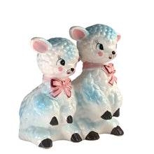 Load image into Gallery viewer, Adorable and rare, anthropomorphic hand painted pale blue double lamb planter with each lamb wearing a pink bow. Crafted by ARCO, Japan, 1950s. A sweet kitschy addition for your new addition. Use for tiny plants or repurpose to hold baby accessories.
In excellent as found vintage condition, no chips/cracks/repairs, normal crazing present.
Measures 5 1/2 x 4 3/4 x 6 inches