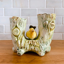 Load image into Gallery viewer, Once can't help but smile at this adorable pale green double tree trunk vase with sweet yellow bird perched in the middle and gold gilt details. This vessel is perfect for creating a small floral bouquet or simply display it amongst your treasures. Produced by Ucagco, Japan, circa 1950s. In excellent condition, free from chips/cracks/repairs. Marked Japan on the bottom. Measures 5 1/8 x 3 x 4 1/4 inches