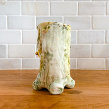 Load image into Gallery viewer, Once can't help but smile at this adorable pale green double tree trunk vase with sweet yellow bird perched in the middle and gold gilt details. This vessel is perfect for creating a small floral bouquet or simply display it amongst your treasures. Produced by Ucagco, Japan, circa 1950s. In excellent condition, free from chips/cracks/repairs. Marked Japan on the bottom. Measures 5 1/8 x 3 x 4 1/4 inches
