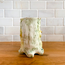 Load image into Gallery viewer, Once can't help but smile at this adorable pale green double tree trunk vase with sweet yellow bird perched in the middle and gold gilt details. This vessel is perfect for creating a small floral bouquet or simply display it amongst your treasures. Produced by Ucagco, Japan, circa 1950s. In excellent condition, free from chips/cracks/repairs. Marked Japan on the bottom. Measures 5 1/8 x 3 x 4 1/4 inches