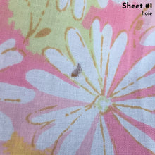 Load image into Gallery viewer, Vintage Dream Garden flat twin sheet featuring a flower power pattern in shades of pink, yellow, green and white. 50% polyester / 50% cotton. Crafted by St. Mary’s, USA, 1970/71. A beautiful addition to your retro boho bedding decor, or repurpose for crafting.
In as found vintage condition.
Sheet #1 has one small hole and a 2-1/2 inch tear near the bottom of the sheet that been poorly mended.
Sheet #2 has two small holes. Please see photos.
Measures 72 x 104 inches