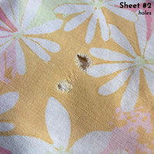 Load image into Gallery viewer, Vintage Dream Garden flat twin sheet featuring a flower power pattern in shades of pink, yellow, green and white. 50% polyester / 50% cotton. Crafted by St. Mary’s, USA, 1970/71. A beautiful addition to your retro boho bedding decor, or repurpose for crafting.
In as found vintage condition.
Sheet #1 has one small hole and a 2-1/2 inch tear near the bottom of the sheet that been poorly mended.
Sheet #2 has two small holes. Please see photos.
Measures 72 x 104 inches