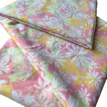 Load image into Gallery viewer, Vintage Dream Garden flat twin sheet featuring a flower power pattern in shades of pink, yellow, green and white. 50% polyester / 50% cotton. Crafted by St. Mary’s, USA, 1970/71. A beautiful addition to your retro boho bedding decor, or repurpose for crafting.
In as found vintage condition.
Sheet #1 has one small hole and a 2-1/2 inch tear near the bottom of the sheet that been poorly mended.
Sheet #2 has two small holes. Please see photos.
Measures 72 x 104 inches