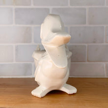 Load image into Gallery viewer, Vintage gloss white Duck and Egg planter. Crafted by McCoy Pottery, 1950s. This rare planter must for any art pottery collector!
In used vintage condition, no chips/repairs, tight hairline at the back of the egg, cold paint has rubbed off. McCoy mark on the bottom.
Measures 7 x 3 1/4 x 5 1/4 inches